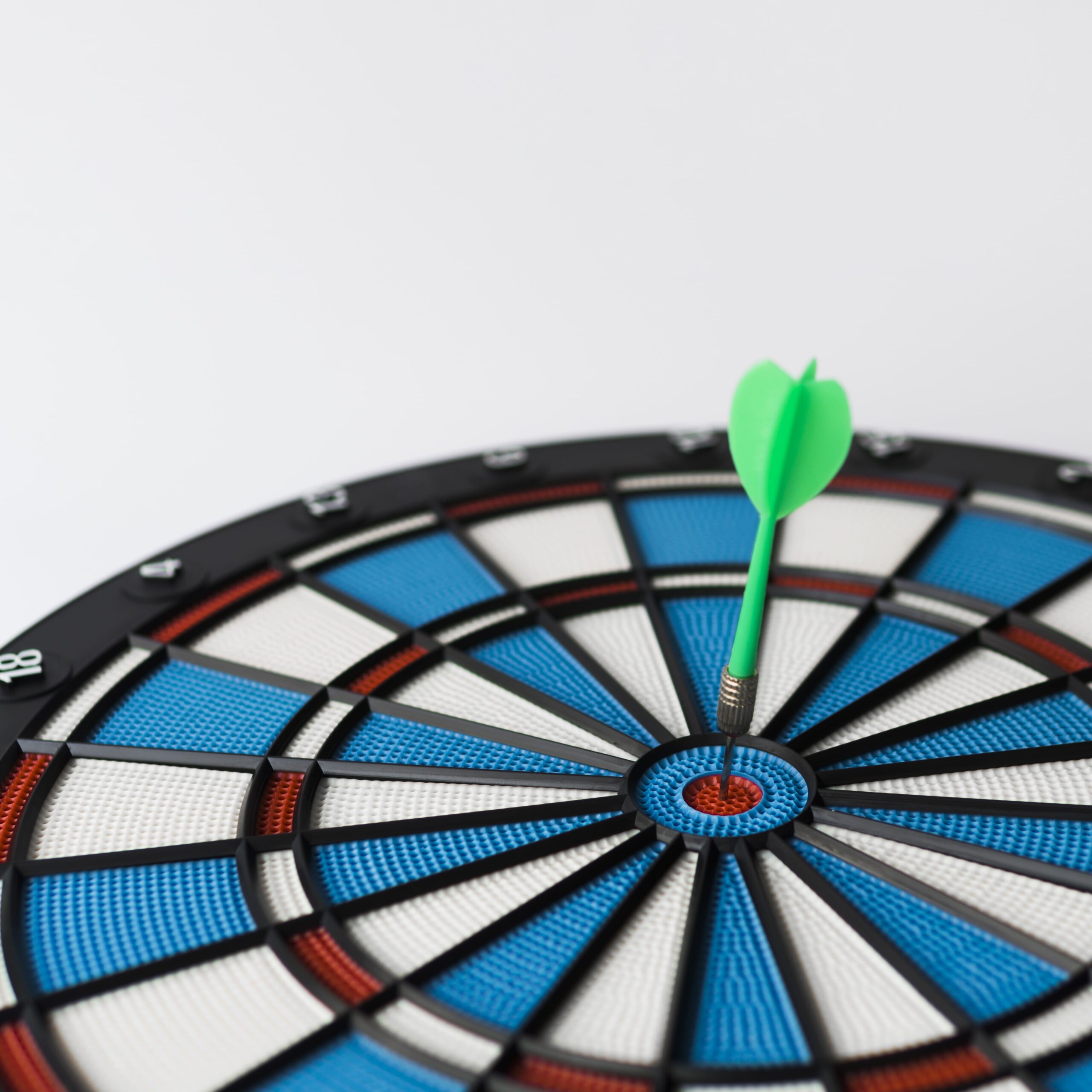high-angle-colorful-dart-stuck-bull-s-eye